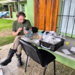Ryan Bacon counting specimens at Parque Nacional Tapanti.